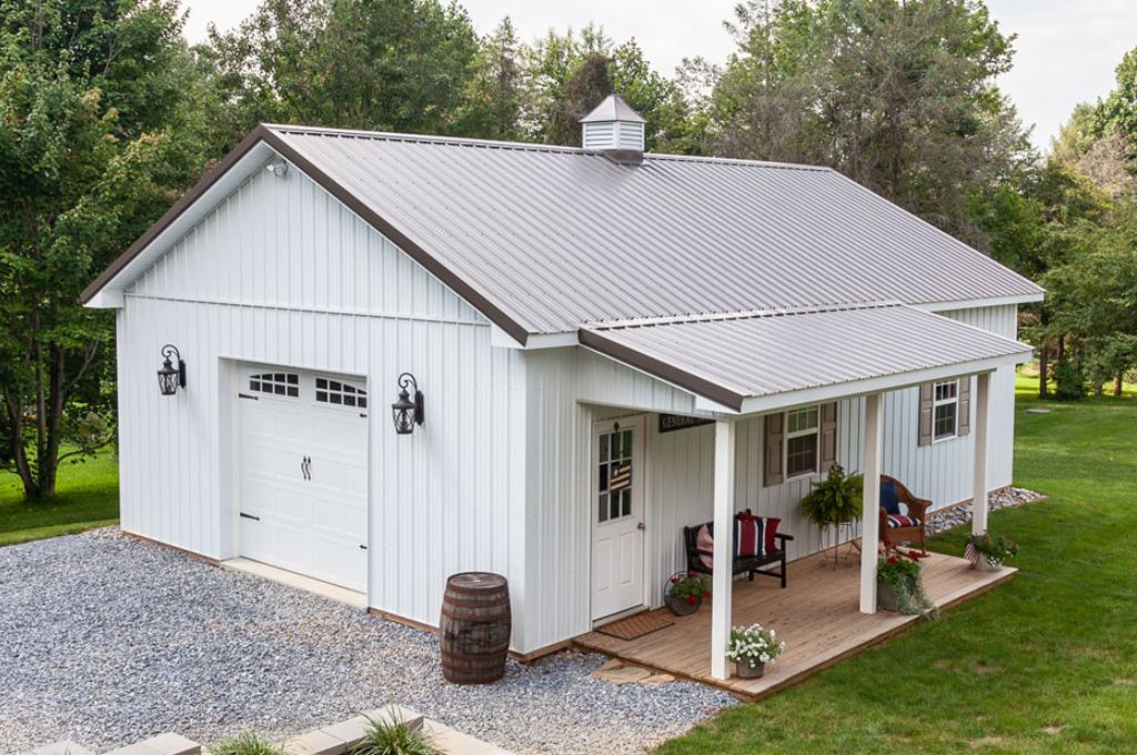 farm style barndominium design with white exterior, overhanging porch, and single car garage